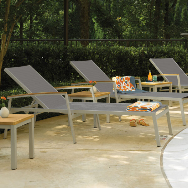 Oxford Garden Travira Sling Chaise Lounge – Flint Frame with Bellows Sling & Natural Tekwood Arm